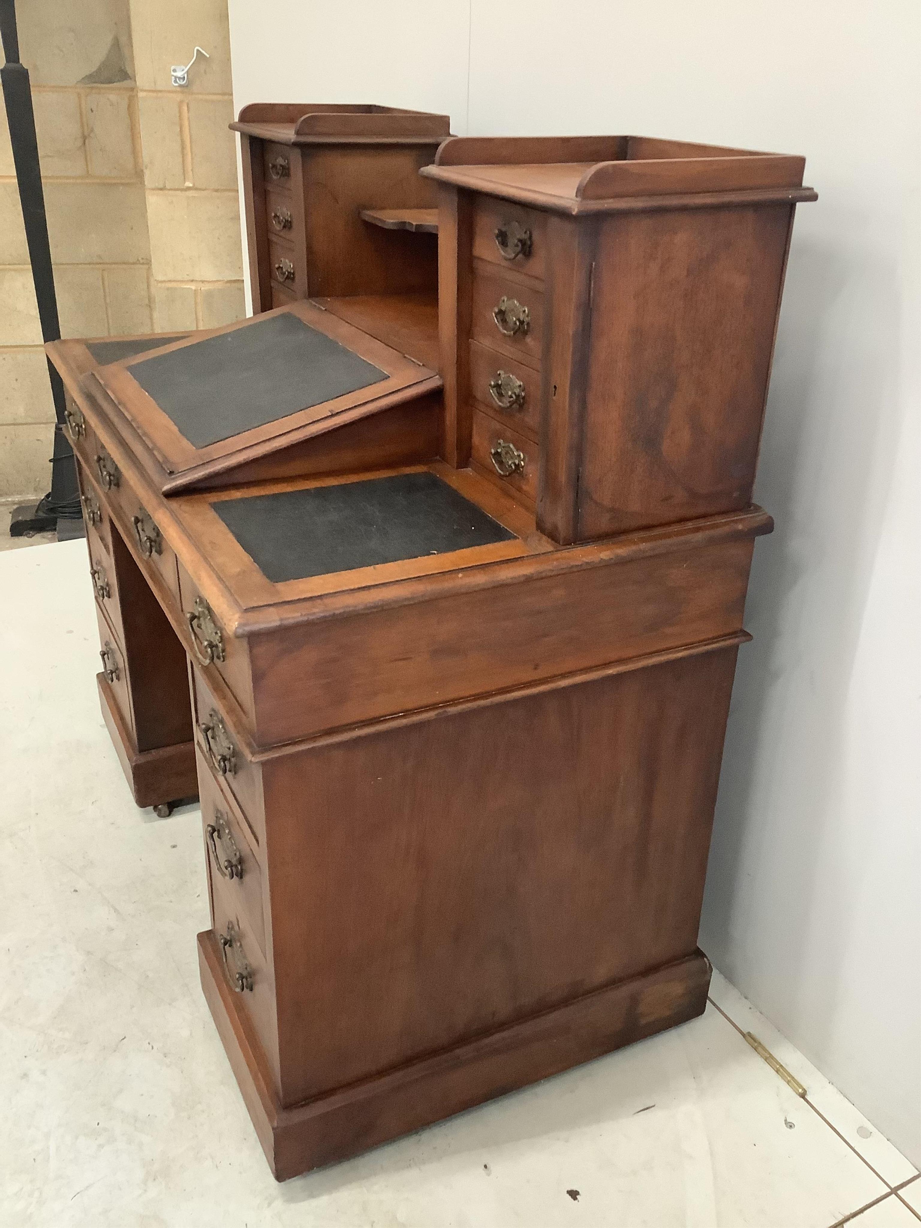 A late Victorian mahogany pedestal desk with raised superstructure, width 111cm, height 111cm. Condition - fair